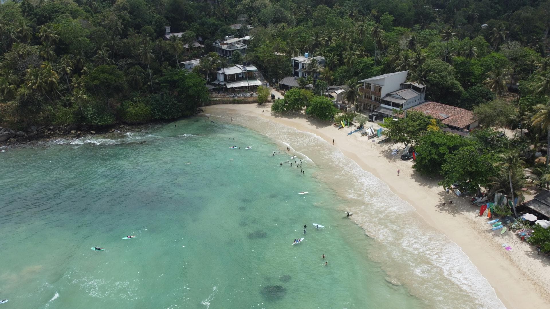 Aerial view of a horseshoe-shaped surf beach on Sri Lanka's south coast